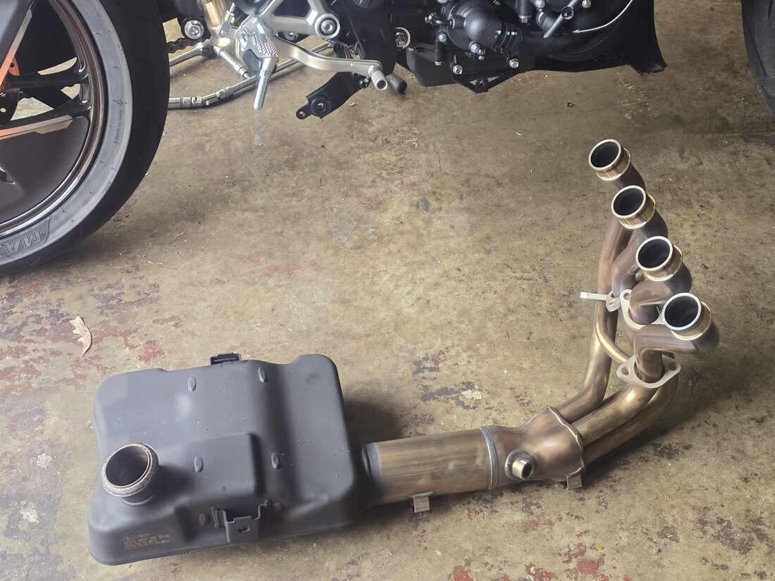 Stock OEM header and breadbox removed from the CFMoto 750SR-S